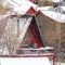 Square Stunning winter neighborhood with colorful houses nestled on snow covered hill