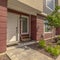 Square Sunny day view of townhomes with pathways on the yard leading to front doors