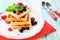 Square sweet waffles with berries