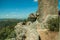 Square tower on top of rocky hill in a castle