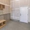 Square Unfinished mudroom interior with seat and shelving units