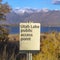 Square Utah Lake Public Access Point sign on a grassy terrain viewed on a sunny day