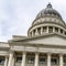 Square Utah State Capital building with stairs leading to the pedimented entrance