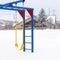 Square Vibrant swings and monkey bar against the white snow covered winter landscape