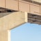 Square View beneath a stringer bridge with massive abutment that supports the deck