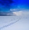 Square vivid winter morning on frozen lake with footprints