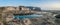 Square water reservoir on the rocky sea coast, Gozo.