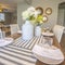 Square White dinnerware and table runners at the dining room of a family home