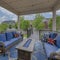 Square White puffy clouds Cozy outdoor deck with fire pit table and woven sofas with blue