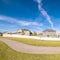 Square Winding walkway through a grassed park during day