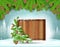 Square wood border stand on snow under fir tree branch on winter frost landscape. Christmas background