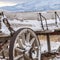 Square A worn out wooden wagon with rusty wheels and powdery snow viewed in winter