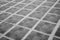 Squares on the floor monochrome. Granite surface black and white. Square marble tiles on the ground. Gray mosaic pavement.