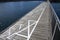 Squares painted in white on boardwalk by the sea for social distancing to prevent the spread of Coronavirus