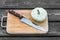 Squash on a cutting board wooden background with steel knif