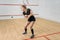 Squash game training, female player with racket