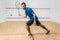 Squash game training, male player with racket