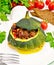 Squash green stuffed with meat on light board