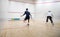 Squash players in action on a squash court