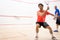 Squash players in action on a squash court