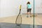 Squash racket leaned on net and sportspeople playing