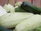 Squashes and patisons on a wooden terrace.