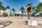 Squat jump on training box in outdoor beach gym. Man athlete training workout at Fitness bench jumping outside summer