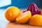 Squeezer with lemons lying on a wooden table