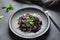 Squid Ink Pasta with , parmesan, basil leaves. Black spaghetti, black organic noodles