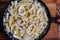 Squid pasta composition on a wooden background