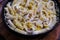 Squid pasta composition on a wooden background