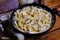 Squid pasta composition on a wooden background