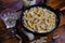 Squid pasta composition on a wooden background