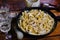 Squid pasta composition on a wooden background