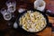 Squid pasta composition on a wooden background