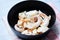 Squid salad bowl with herbs and spices sauce seafood on dining table - Tentacles octopus cooked appetizer food cooked in the