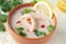 Squid soup with coconut milk, pepper and lemon