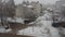 Sremska Mitrovica, Serbia, January 20, 2023. Snowfall in the city. Large white snowflakes fall from a cloudy sky