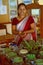 Sri Lanka: A ayurvedic woman doctor showing the herbes for the herbal medicin