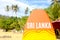 Sri Lanka sign on the orange surf with beach background