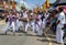 Sri Lankan girls dance to the beat of Yak Beraya drums during the Hikkaduwa perahera in Sri Lanka.