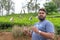 Sri Lankan male guide tells tourists about tea plantations. Sri-Lanka, Unawatuna, October 31, 2019