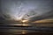 Sri-Lankian beautiful sunset over the sea, waves and cloudy dark sky