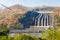 Srinakarin Dam the power station with large mountains and many trees at Kanchanaburi, Thailand. To generate electricity