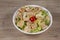 Sriracha Chicken Salad in white bowl on wooden background