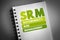 SRM - Sustainability Risk Management acronym on notepad, business concept background