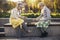 Ssenior adult women playing chess on the bench outdoors in the park