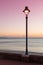 Sstreetlamp and sea at dusk