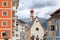 St Antonio Chapel and colorful house facades in Ortisei, with Sella Group mountains in the background
