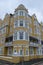 St Aubyns Mansions on Kings Esplanade, Hove, East Sussex, UK. Restored mustard coloured block of flats overlooking the sea